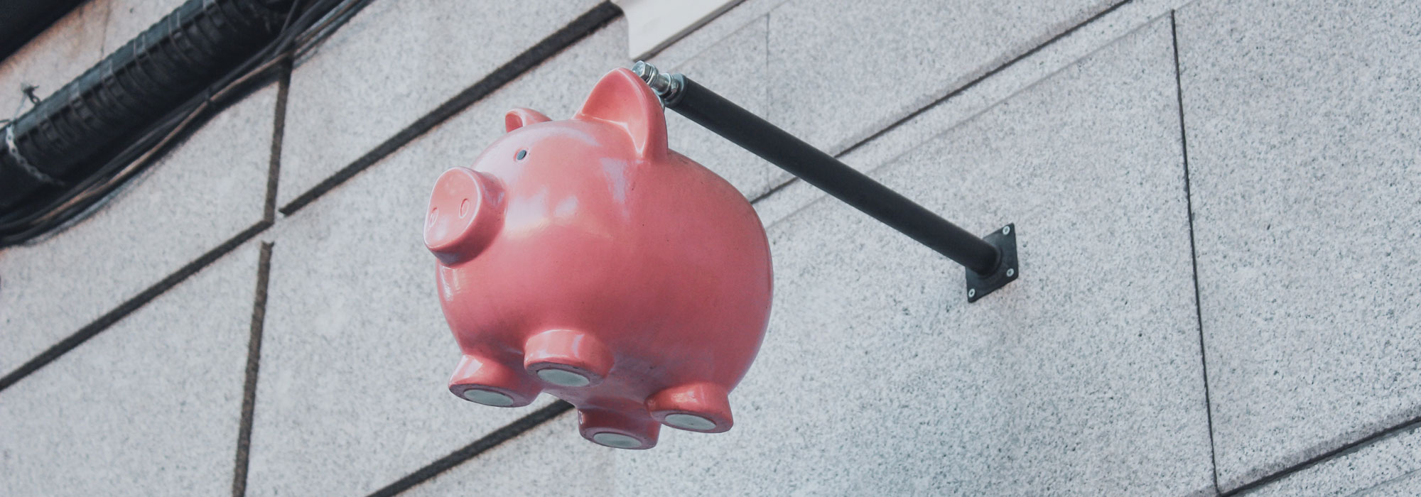 Piggybank on side of building